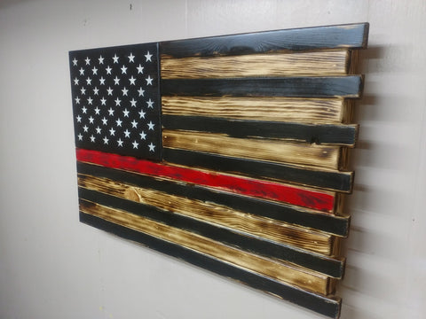 Torched Thin Red Line gun concealment flag uses black and torched wood to create the US flag with white stars and a central red stripe