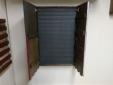 American flag gun concealment flag with one large open compartment hanging vertically on the wall with foam interior