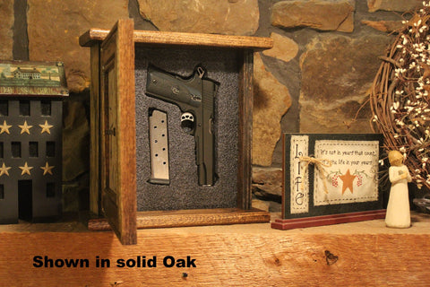 A wooden gun concealment clock sitting on a mantle with it's hidden compartment open to reveal a handgun and one magazine with the words "Shown in solid Oak" written at the bottom.