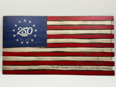 A horizontally-oriented American wooden concealment flag with a red and white distressed finish, featuring 250 with "1776 - 2026" under it, and "I prefer dangerous freedom over peaceful slavery" written at the bottom right.