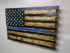 Torched Thin Blue Line concealment flag that uses black and torched wood to create the US flag with white stars and a central blue stripe