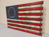 Betsy Ross gun concealment flag has a rustic charm with 13 stars in a circle in the upper left blue section and red and white stripes