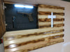 A gun concealment flag with a cross carved out of it, Proverbs 19:5 written on it, and motion activiated LED lights, with its hidden compartment open to reveal a handgun. 