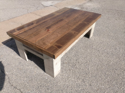 A white gun concealment coffee table with an unpainted sliding top.