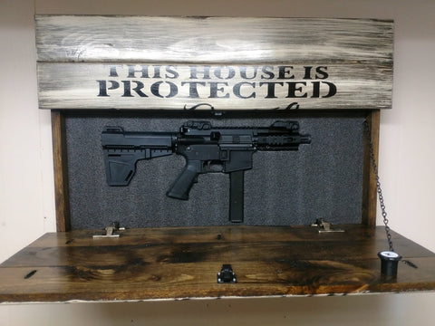 This House is Protected Hidden Gun Storage Sign