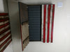 Gun concealment flag haning vertically with the left door open and the right door closed revealing part of the American flag