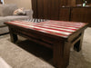 A gun concealment coffee table with an American flag sliding top.