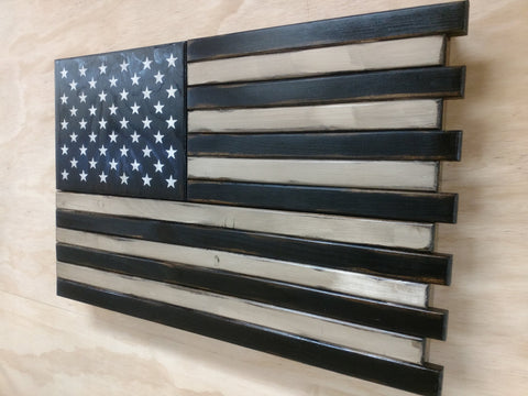 Black & white American flag gun concealment case with black & white stripes, a black top left with white stars overlaid