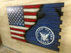 A large closed concealment flag with a standard US flag diagonally converts to a blue background with a white stenciled navy logo