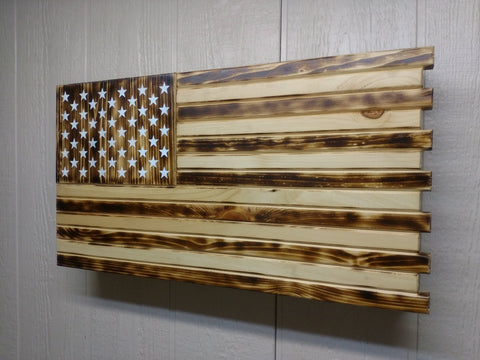 Charred style mini American flag gun concealment case with light & dark brown wood stripes & white stars with natural wood accents.