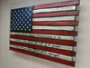 American flag gun concealment case with burnt marks and pro 2nd amendment quote written on the bottom 3 white stripes