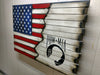 A large concealment case with a US flag converts into a white distressed background with a large black stenciling of POW MIA logo