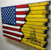 Angled view of gun concealment flag with left half American flag blended with burnt accents to yellow background and don't tread on me logo