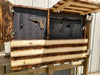 Concealment flag with natural wood that appears charred with the US flag, lower panel is closed and 2 top panels reveal guns held by foam lining