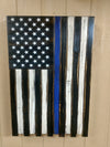 Black & white American police flag gun concealment case hanging vertically with a thin blue stripe on the 3rd stripe up