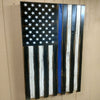 Angled view of black & white American police flag gun concealment case hanging vertically with a thin blue stripe on the 3rd stripe up