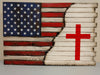 Rustic gun concealment case with half American flag blended with burnt accents to white background with a red Christian cross