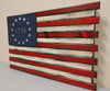 American flag gun concealment case with 13 stars in the top left and 1776 in the middle of the starts with burnt accents throughout.