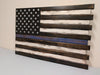 Thin Blue Line wooden concealment flag features a single blue stripe that is positioned centrally amidst a monochromatic style US flag