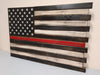 Thin Red Line concealment flag features a single red stripe that is positioned centrally amidst a monochromatic style US flag