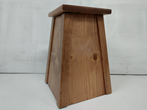 A wooden gun concealment lamp with a cherry wood stain. 