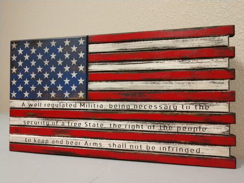Mini American flag gun concealment case with black accents showing through and a second amendment quote on the 3 bottom white stripes.