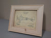 An 8x10 natural wood gun concealment picture frame with a diagram of a single-propeller airplane inside.