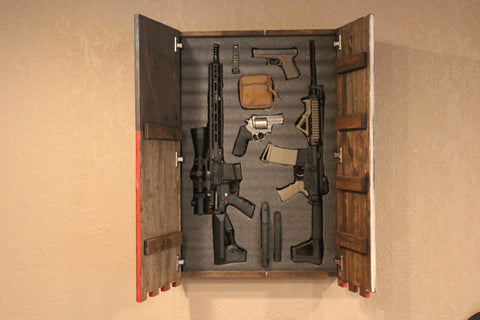 Gun concealment flag with one large open compartment containing 2 rifles, 2 pistols, and ammo storage
