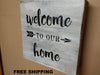 White, distressed mini gun concealment box with text "Welcome to our home" listed.