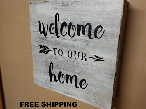 White, distressed mini gun concealment box with text "Welcome to our home" listed.